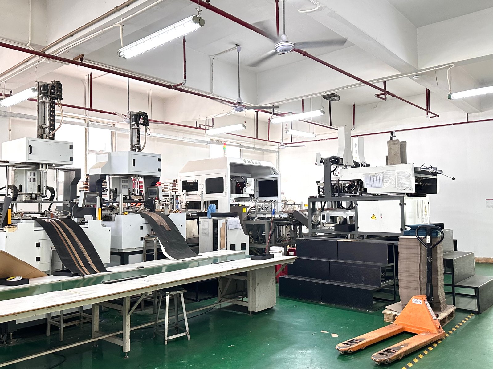 Packaging production workshop with printing and finishing equipment